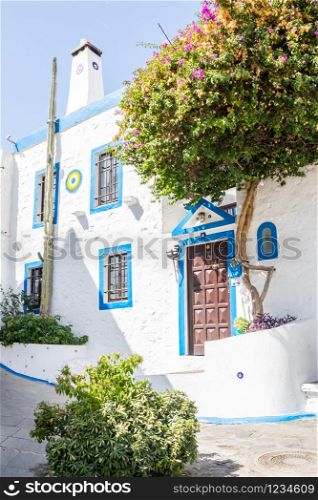Typical old blue and white Turkish house in one of the back streets of Bodrum, Turkey