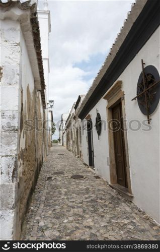 typical old houses in smalll street in algarve portugal