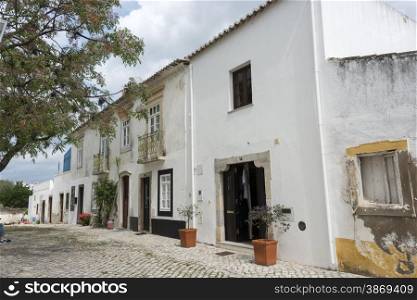 typical old houses in smalll street in algarve portugal near the square