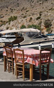 typical outdoor restaurant setting in Kalymnos island port, Greece