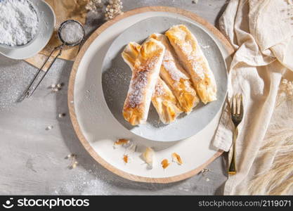 Typical portuguese sweets Pasteis de Vouzela served on countertop. Filo pastry with egg cream filling