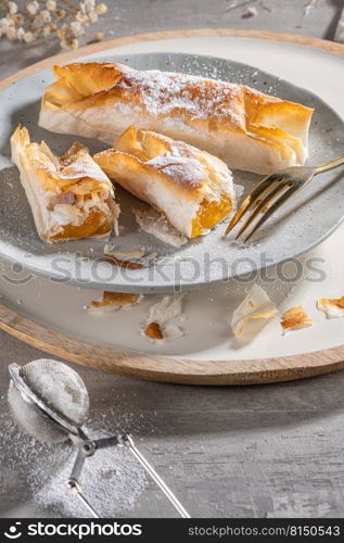 Typical portuguese sweets Pasteis de Vouzela served on countertop. Filo pastry with egg cream filling