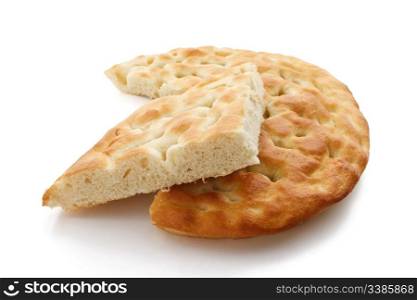 Typical salty italian bread called focaccia over white background