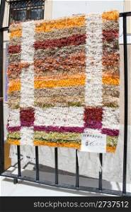 Typical Spanish handmade rug for sale in the village of Nijar, Almeria, Andalusia, Spain.
