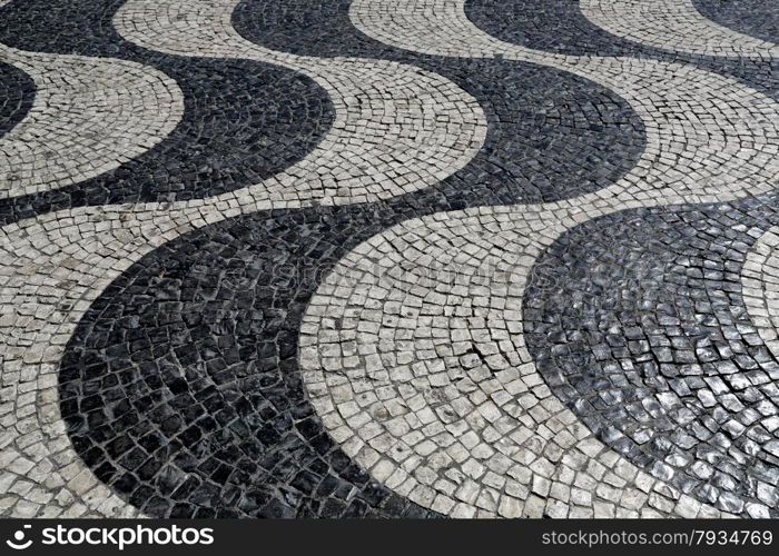 Typical waves of tiled floor in portuguese traditional style