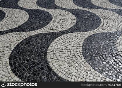 Typical waves of tiled floor in portuguese traditional style