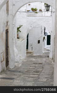 Typical white stone alley in south of Italy