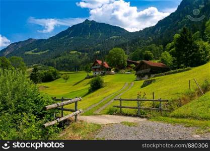 Typical wood house and barn in swiss village Lungern, canton of Obwalden, Switzerland. Swiss village Lungern, Switzerland