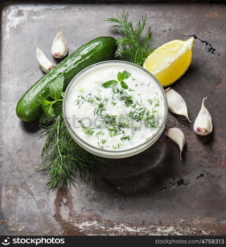 Tzatziki sauce with herbs and vegetables. Food background