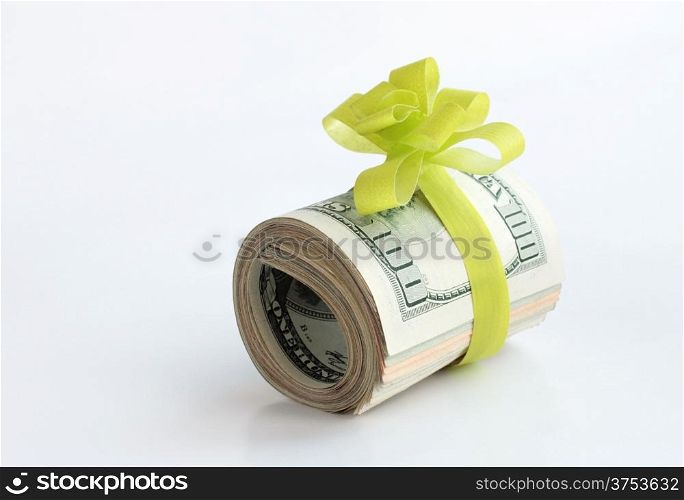 U.S. dollars banknotes with a green ribbon as a gift of money