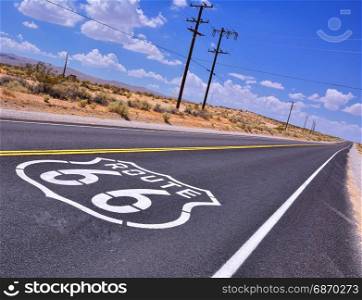 U.S. Route 66 highway, with sign on asphalt on California.