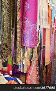 UAE, Dubai, colourful pashminas and fabrics for sale at Bur Dubai souq