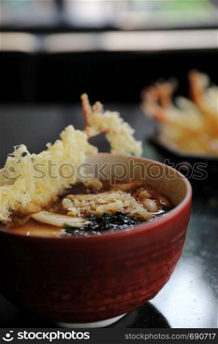Udon noodles with fried shrimp tempura Japanese food