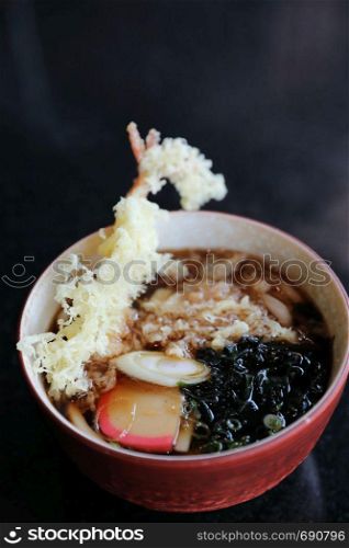 Udon noodles with fried shrimp tempura Japanese food