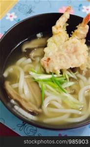 Udon noodles with shrimp tempura , Japanese food