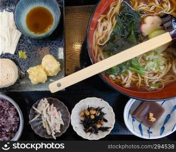 Udon wheat noodles with hot soup, roll soy milk skin, and tempura