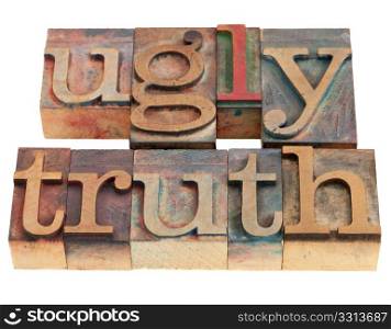 ugly truth phrase in vintage wood letterpress printing blocks isolated on white, selective focus