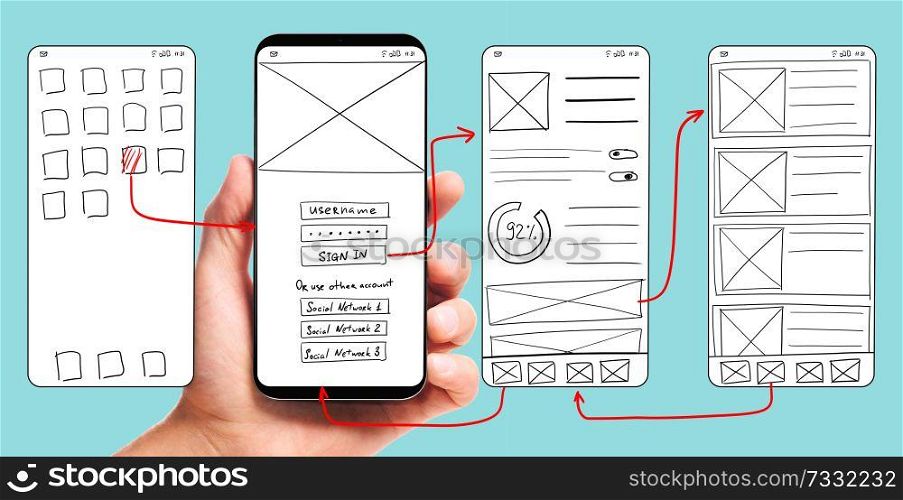 UI development. Male hand holding smartphone with wireframed user interface screen prototypes of a mobile application on blue background.. Developing mobile app UI