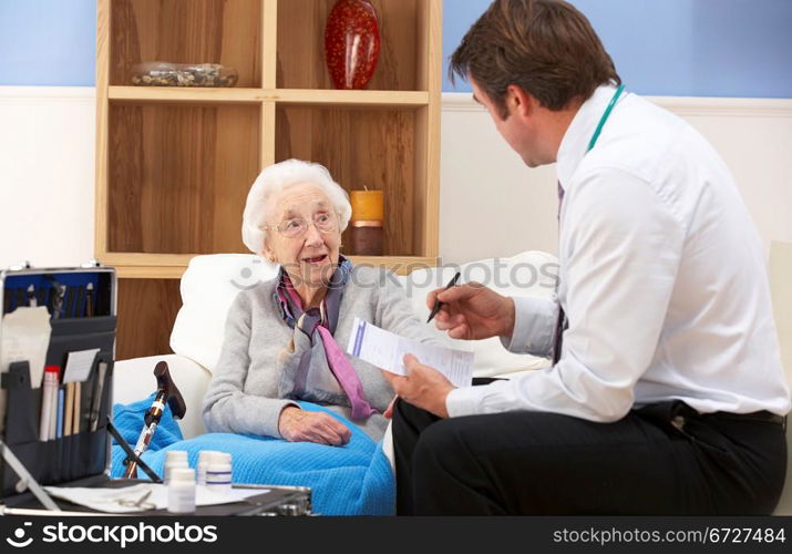 UK GP visiting senior woman at home