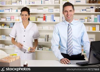 UK nurse and pharmacist working in pharmacy