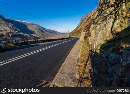 Uk road A5 at Nant Ffrancon Pass, Bethesda. Snowdonia national Park, Gwynedd, Wales, UK. Landscape, wide angle.