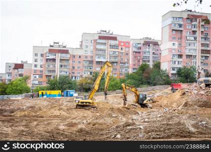 Ukraine, Rovno-November 09, 2021: Crane and construction site, the process of building a new building. Ukraine, Rovno-November 09, 2021: Crane and construction site, the process of building a new building.