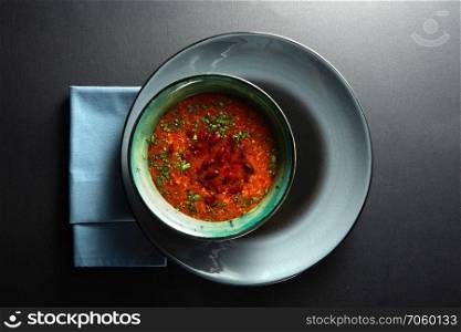 Ukrainian and russian national red soup borsch on black background. Ukrainian and russian national red soup