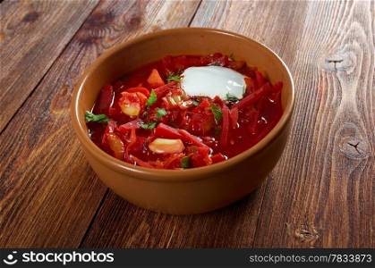ukrainian and russian red-beet soup (borscht) with garlic and sour cream.farm-style