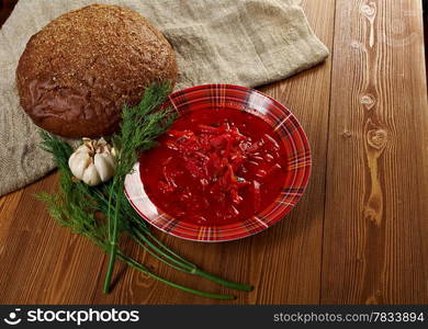 ukrainian and russian red-beet soup (borscht) with garlic and sour cream.farm-style