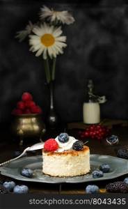 Ukrainian cheesecake with berries and cream, still life