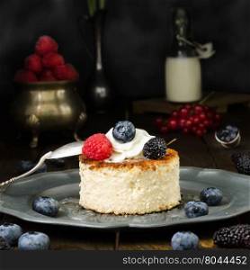 Ukrainian cheesecake with berries and cream, still life