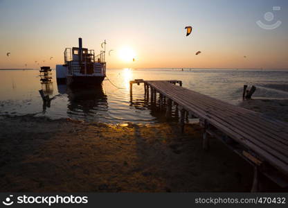 Ukrainian landscape. view of the the sea with the ship and pier in the foreground in sunset time, Ukraine