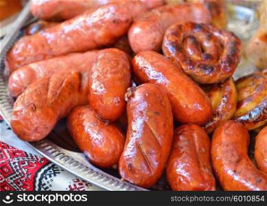Ukrainian national cuisine. Grilled pork sausage with lard and spices