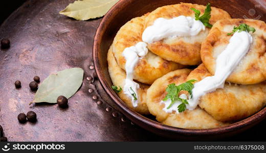 ukrainian potato zrazy. potato homemade zrazy with sour cream on rustic recipe