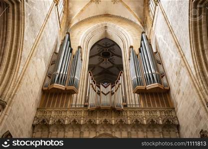 Ulm, Germany - July 20, 2019: Big church organ pipes, Interior of the Ulm Cathedral the tallest church in the world.