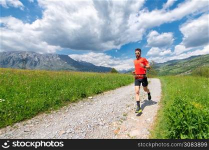 Ultra trail runner athlete prepares on a dirt road