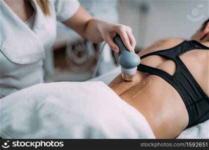 Ultrasound in Physical Therapy. Therapist Using Ultrasound Applicator on a Patient&rsquo;s Lower Back