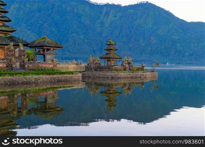 Ulun Danu Bratan Temple and lake in Bali. It is one of the most popular of tourist attraction. Indonesia. Hindu pagoda architecture of travel trip and holidays vacation in Indonesia.
