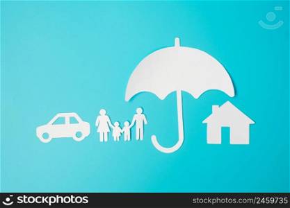 Umbrella cover family, home and Car shape paper on blue background. International day of families, Healthcare, wellness and Insurance concept