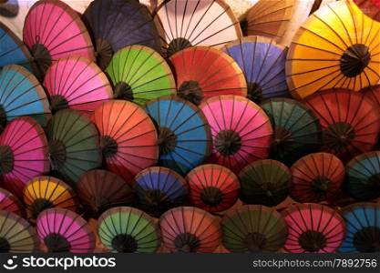 umbrellas at the nightmarket in the town of Luang Prabang in the north of Lao in Souteastasia.. ASIA LAO LUANG PRABANG