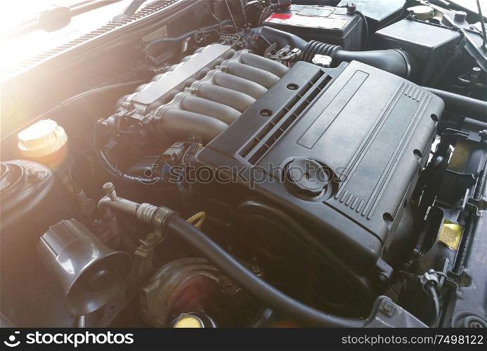 Unbranded car engine with sun flare .