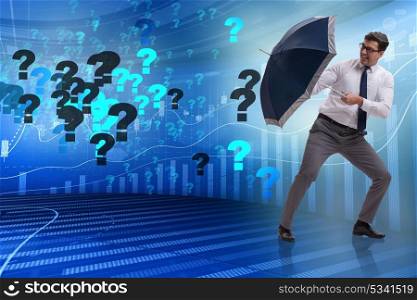 Uncertainty concept with businessman and question marks