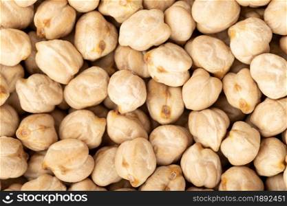 Uncooked chickpea background texture. Full frame Cicer arietinum
