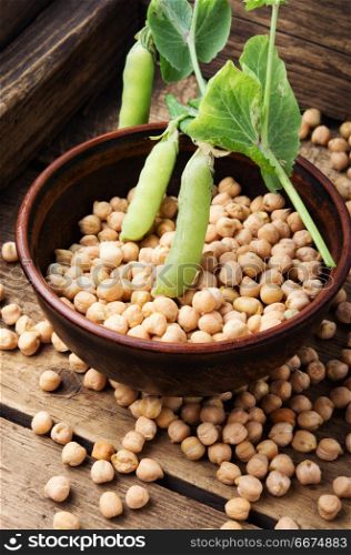 Uncooked chickpeas grains in bowl. Chickpea-for cooking traditional dishes of Middle Eastern cuisines.Healthy food