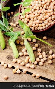 Uncooked chickpeas grains in bowl. Chickpeas - food product popular in the Middle East, for cooking traditional dishes.Healthy and vegetarian food