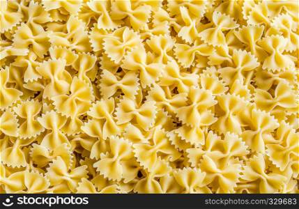 Uncooked farfalle pasta background