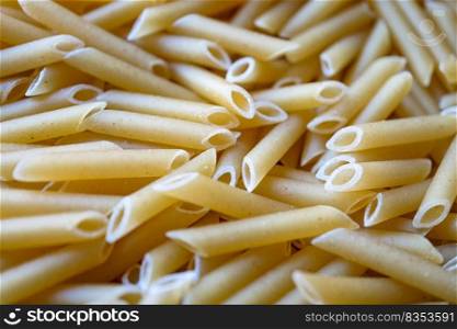 uncooked macaroni pasta background, italian food