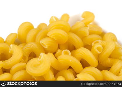 Uncooked pasta selection in a bowl isolated on white background.