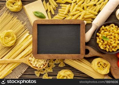 uncooked pasta with blackboard mock up. Resolution and high quality beautiful photo. uncooked pasta with blackboard mock up. High quality and resolution beautiful photo concept