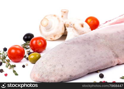 uncooked raw tongue with serving spices on white background